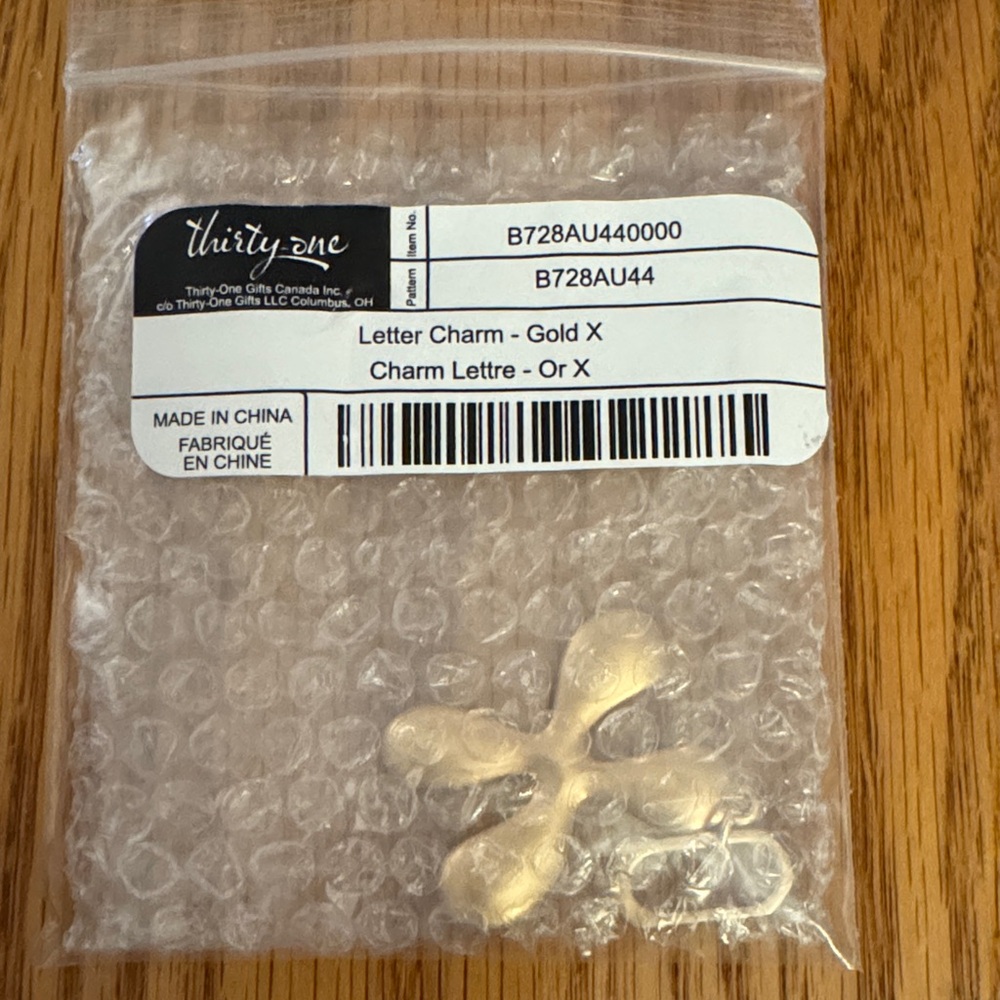 Thirty-One Gold X Charm